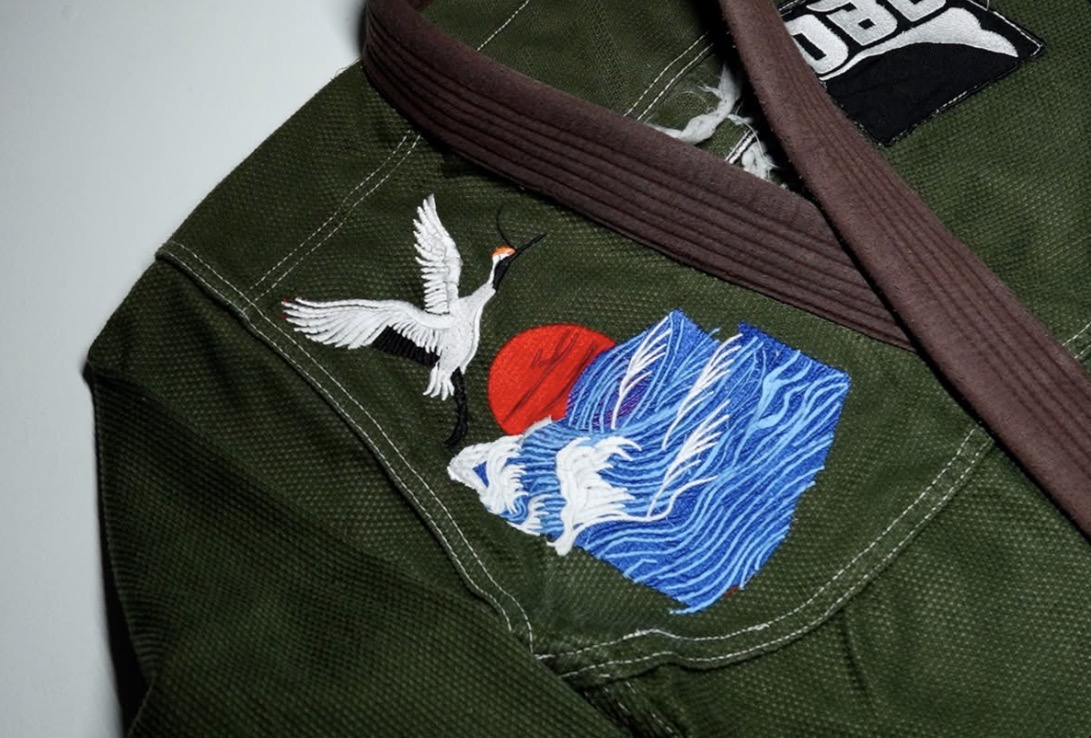 Close view of the Crane Gi chest embroidery and brown collar