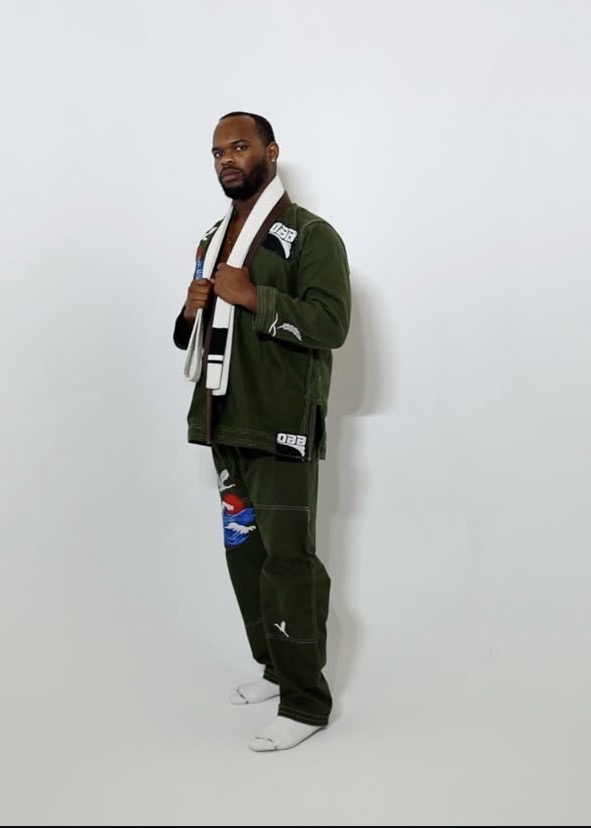 Full-length portrait of a model wearing the olive Crane Gi